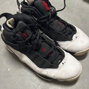 Air Jordan Black and White High-Top Sneakers with Red Accents